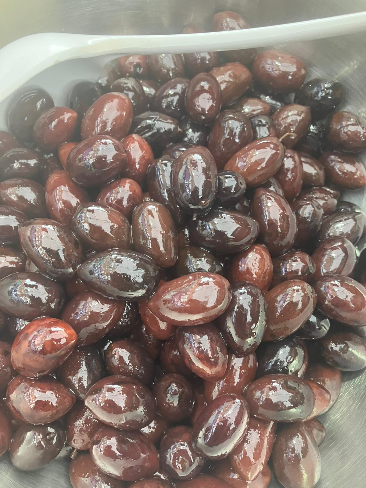 Stuffed Greek mammoth olives on display