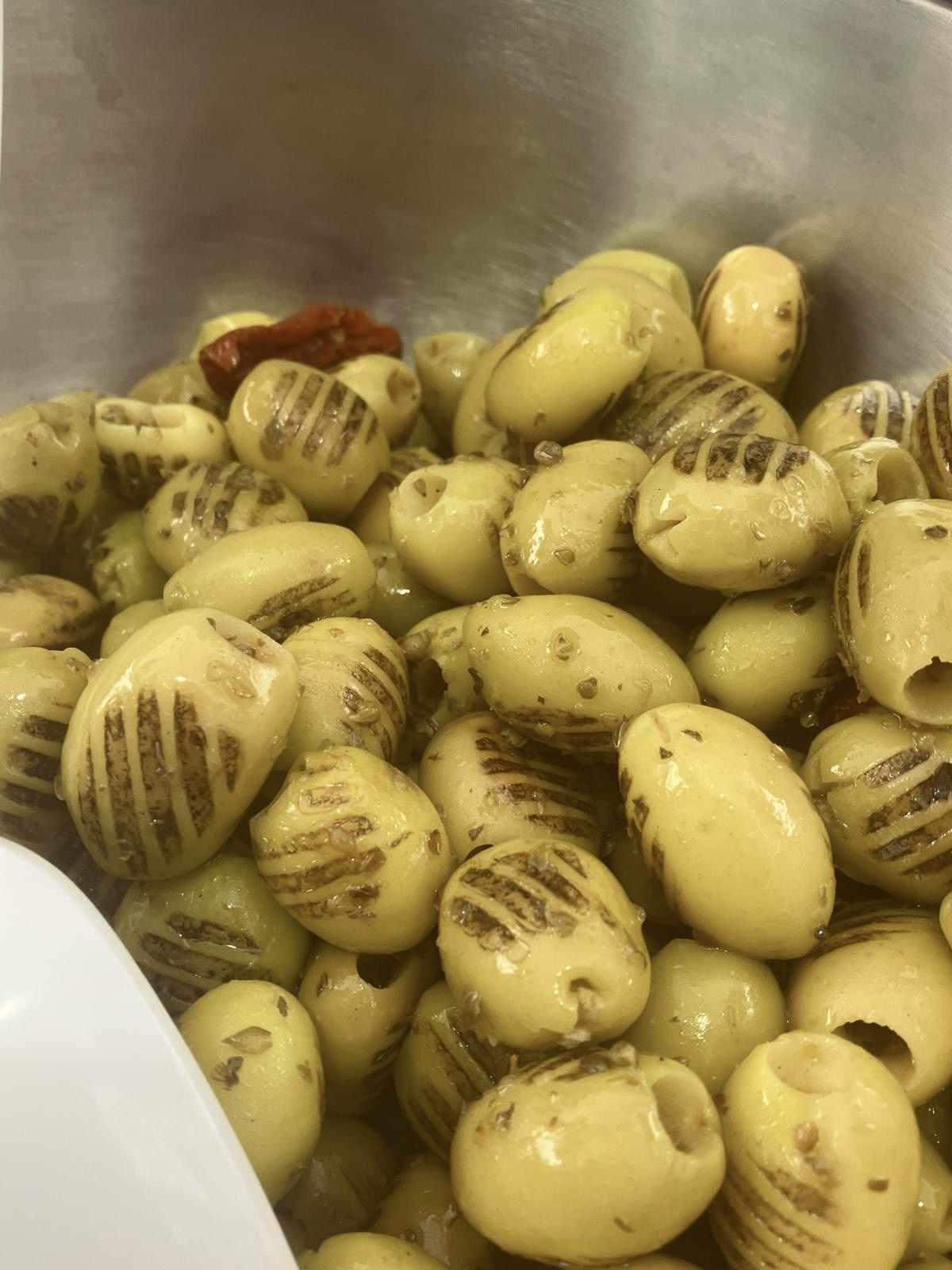 Grilled Turkish olives with char marks