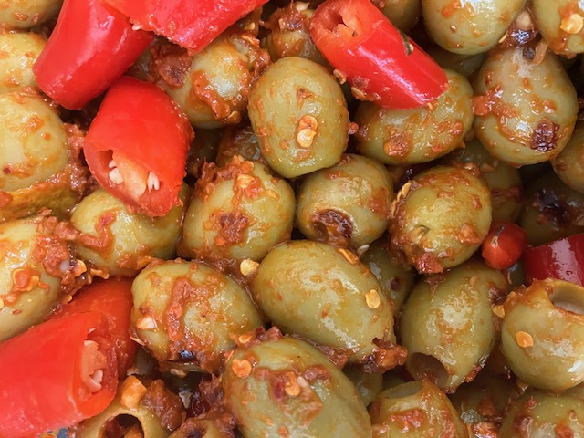Mammoth pitted olives smothered in Tunisian harissa paste with red chilli